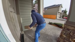 Person stealing package from porch